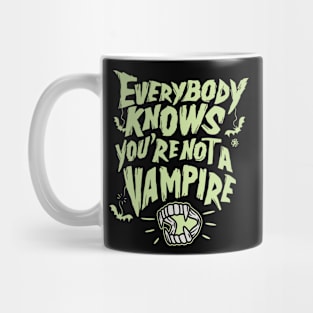 Every knows you are not a vampire Mug